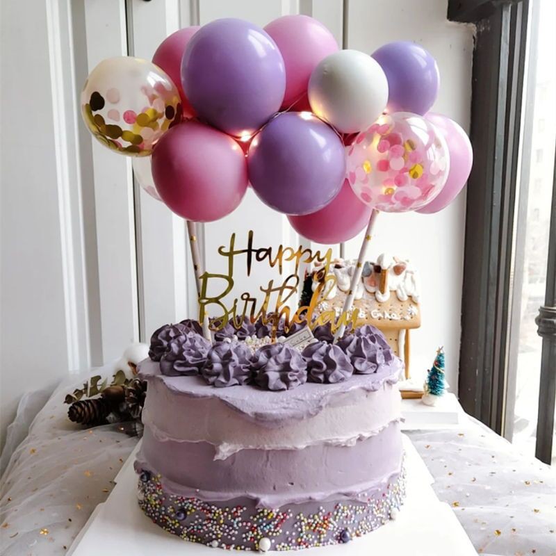 Premium AI Image | A birthday cake with balloons and confetti on it.